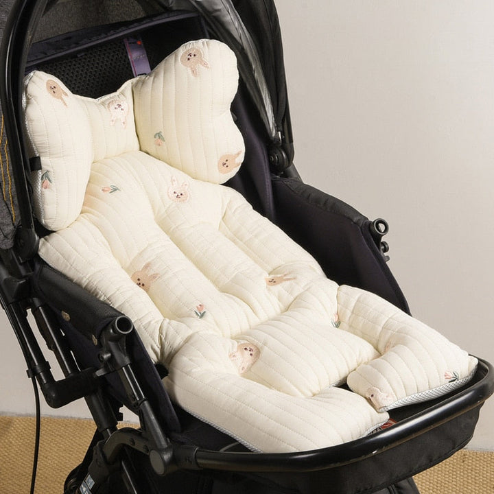 Rolled up stroller cushion showing compact portability for travel and storage