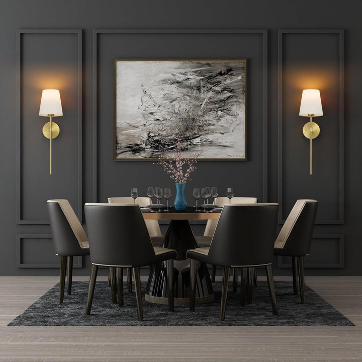 A pair of gold NovaGlow luxury wall lamps illuminating a stylish dining room wall