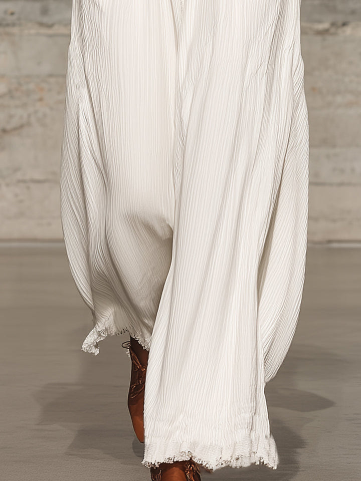 Full view of women's white wide-leg trousers with comfy elastic waist, ideal for summer casual wear.