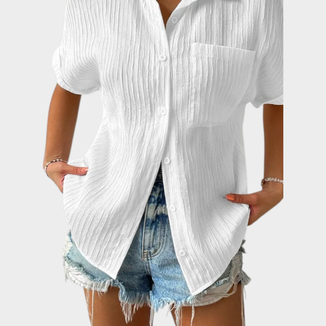 Lower half view of the white textured button-up shirt relaxed fit
