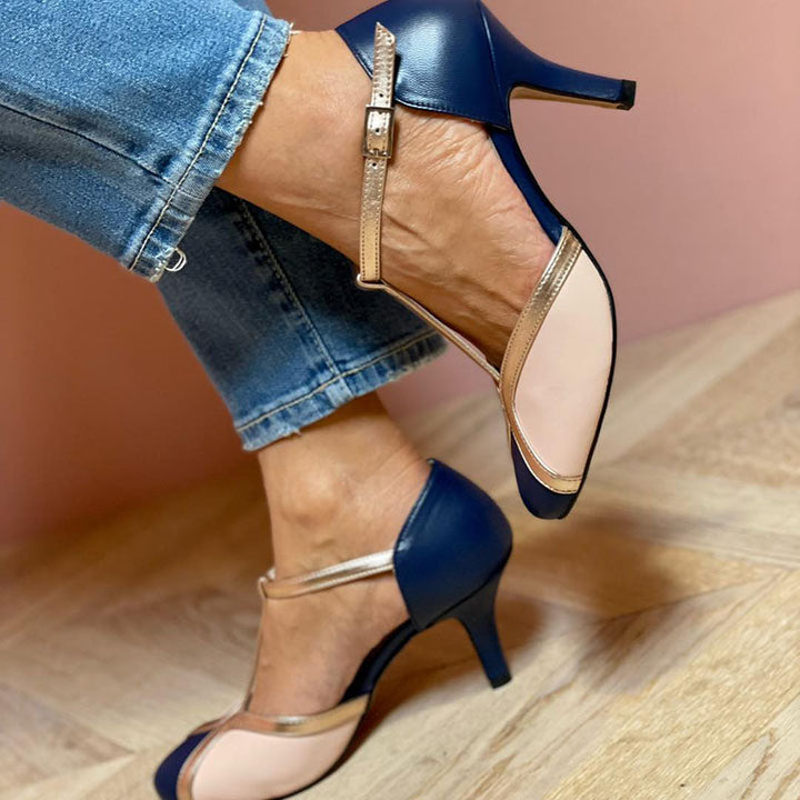 Close-up of ankle buckle and side profile of navy T-strap heels