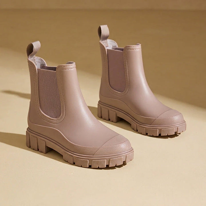 Pair of women's waterproof rain boots neatly arranged together
