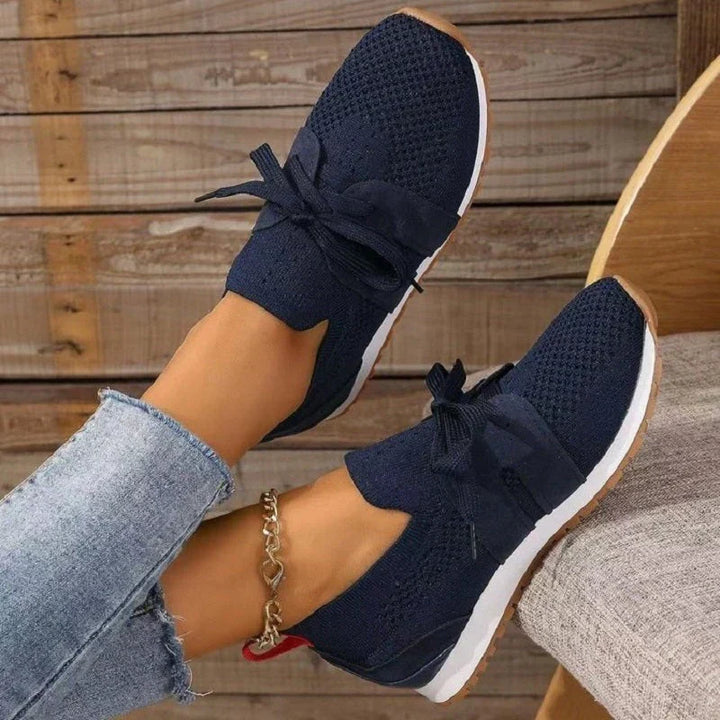 Blue women's orthopedic comfort heeled shoes paired with jeans