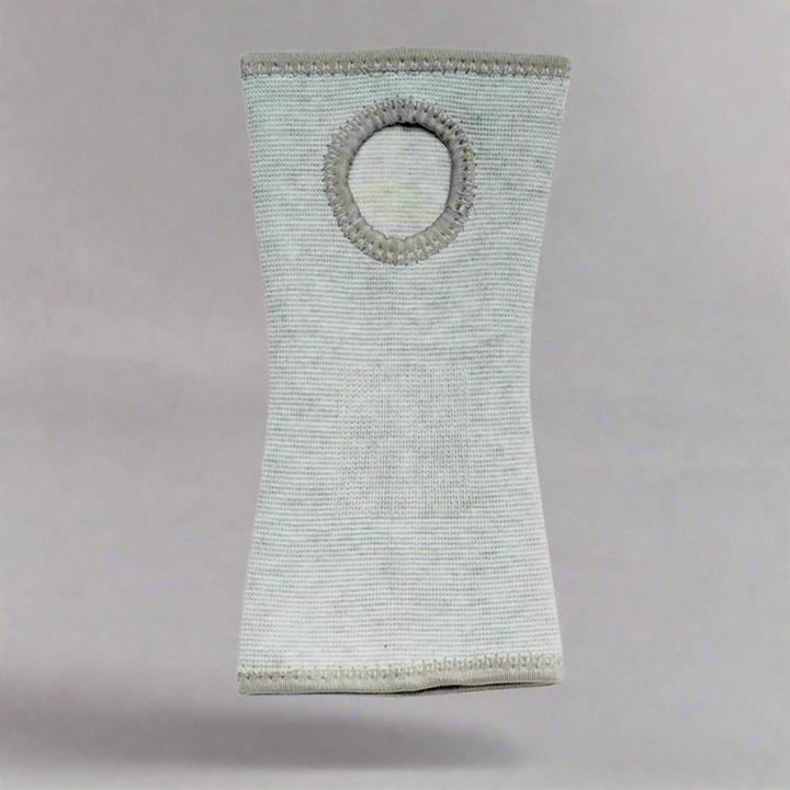Close-up of breathable fabric on grey wrist support sleeve for carpal tunnel
