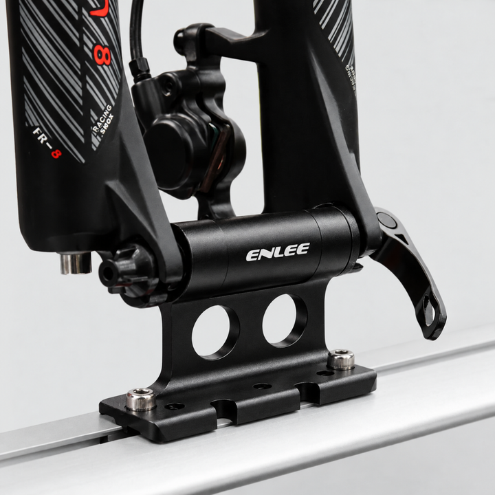 Close-up of bike fork attached to the aluminum mount on a roof rail