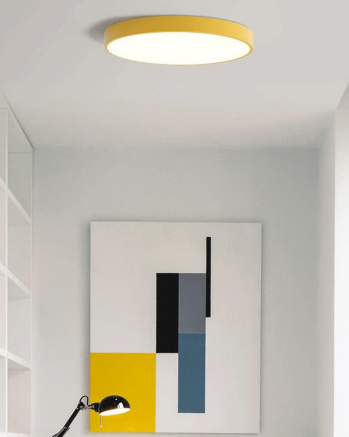 Complete view of the minimalist disc LED ceiling lamp in a styled room