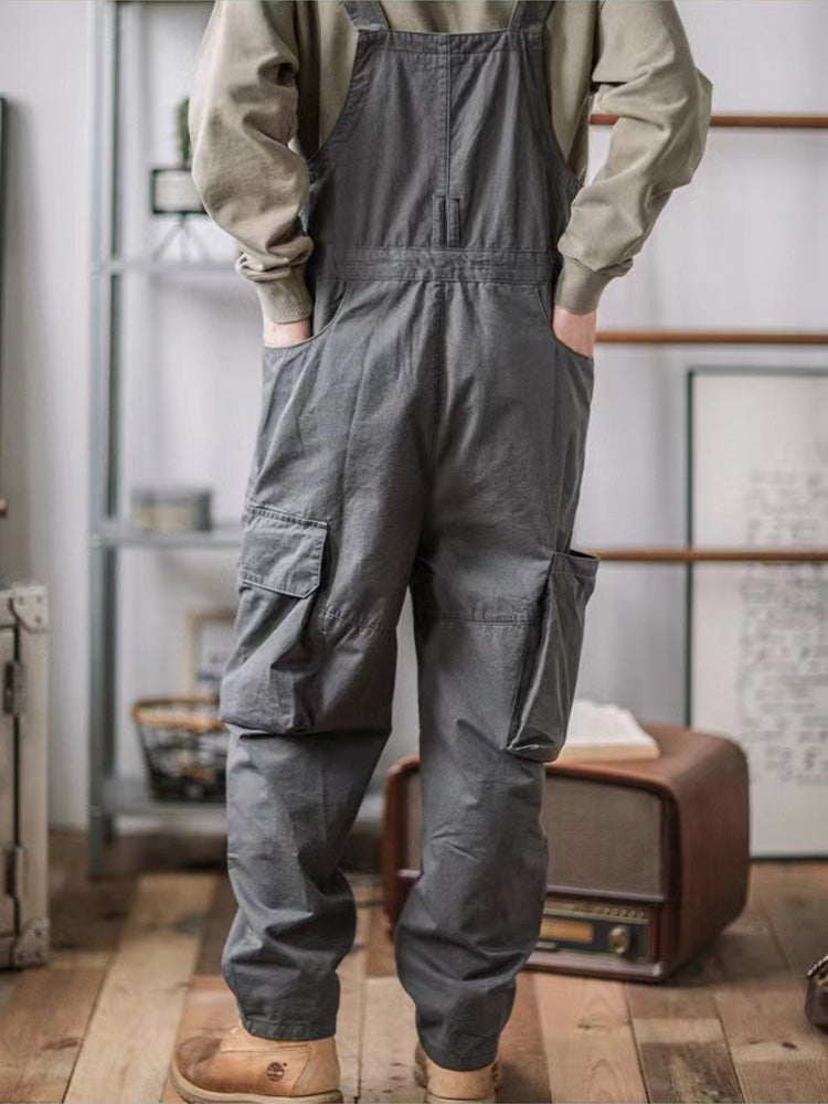 Folded men's utility overalls displaying rugged texture and quality fabric