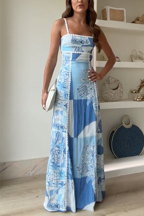 Woman wearing a light blue maxi dress with patterned design and white trim
