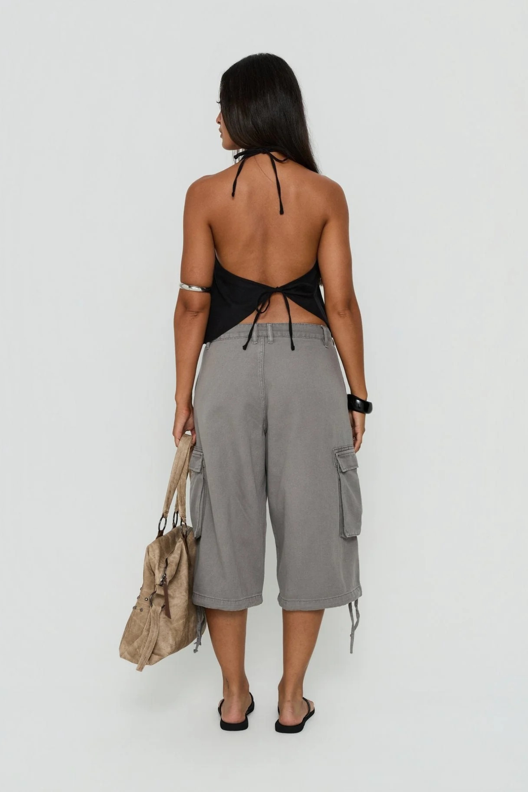 Flat lay of women's cargo utility shorts with multiple pockets