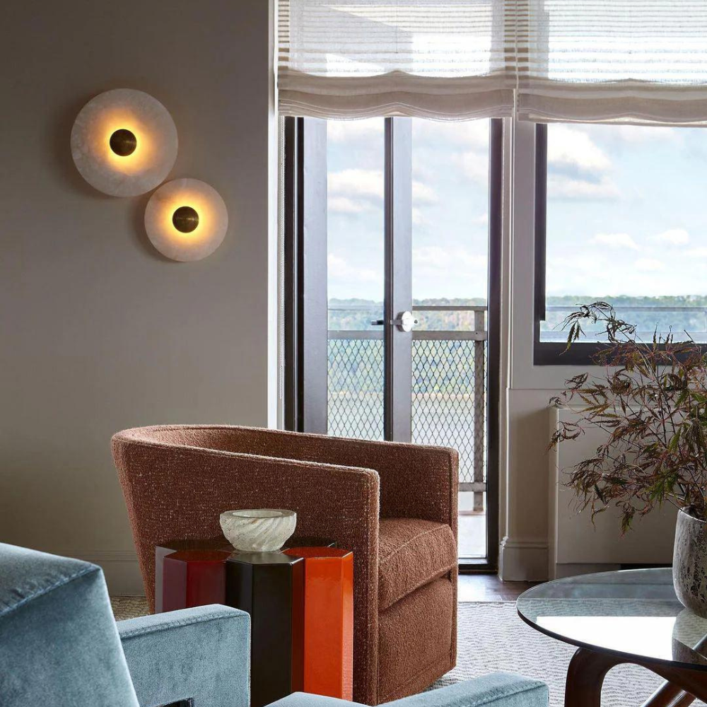 Minimalist modern design alabaster wall lamp mounted on a dark accent wall