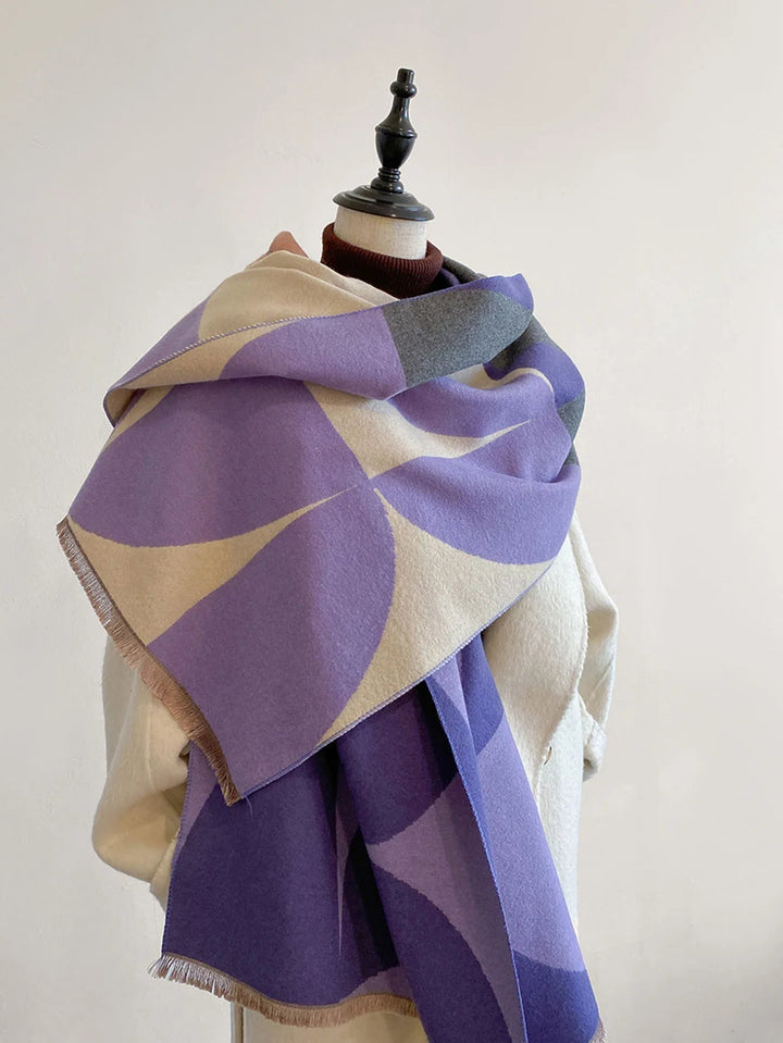Purple and beige patterned reversible soft wrap scarf draped on a mannequin