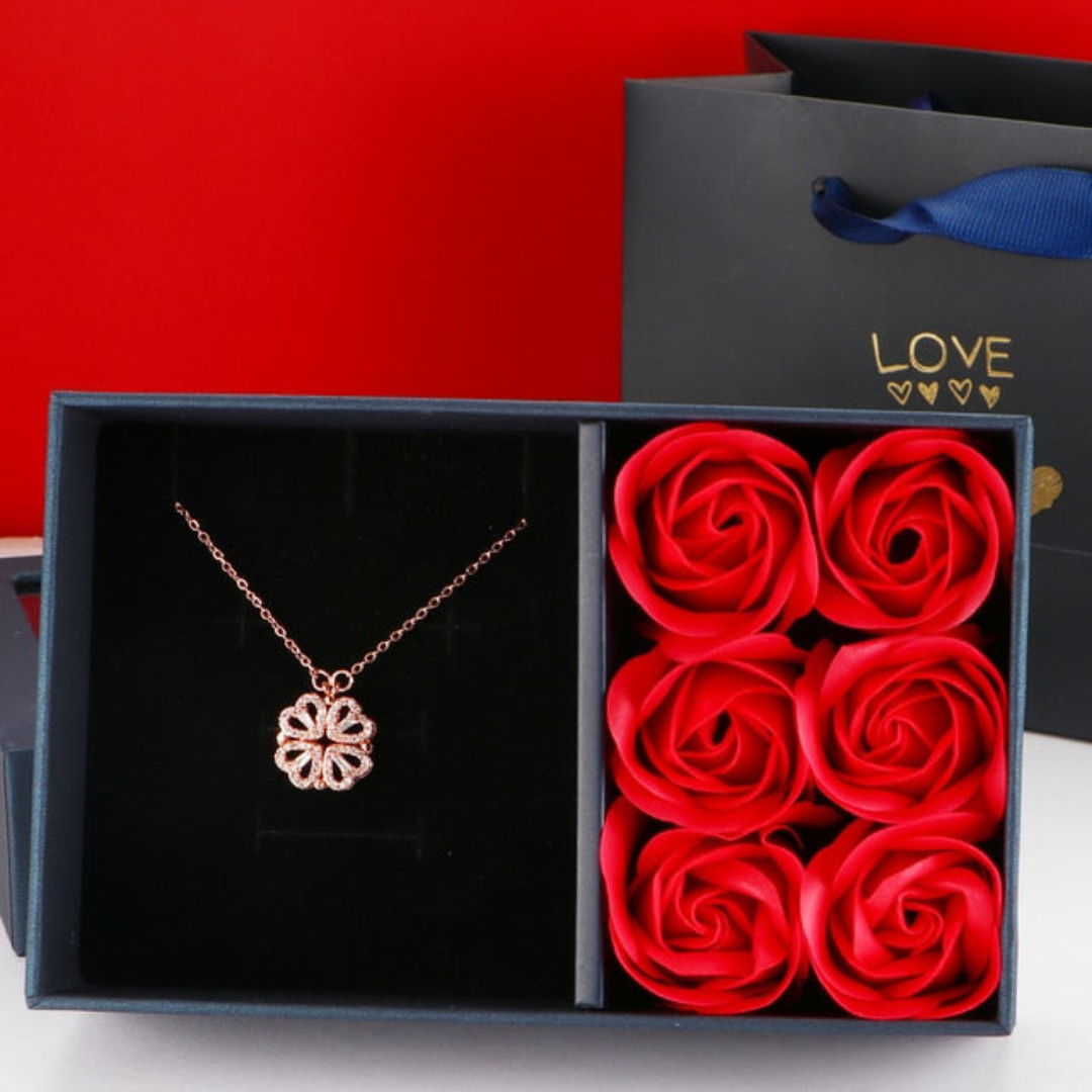 Rose gold diamond-look necklace presented in a gift box with red rose soaps
