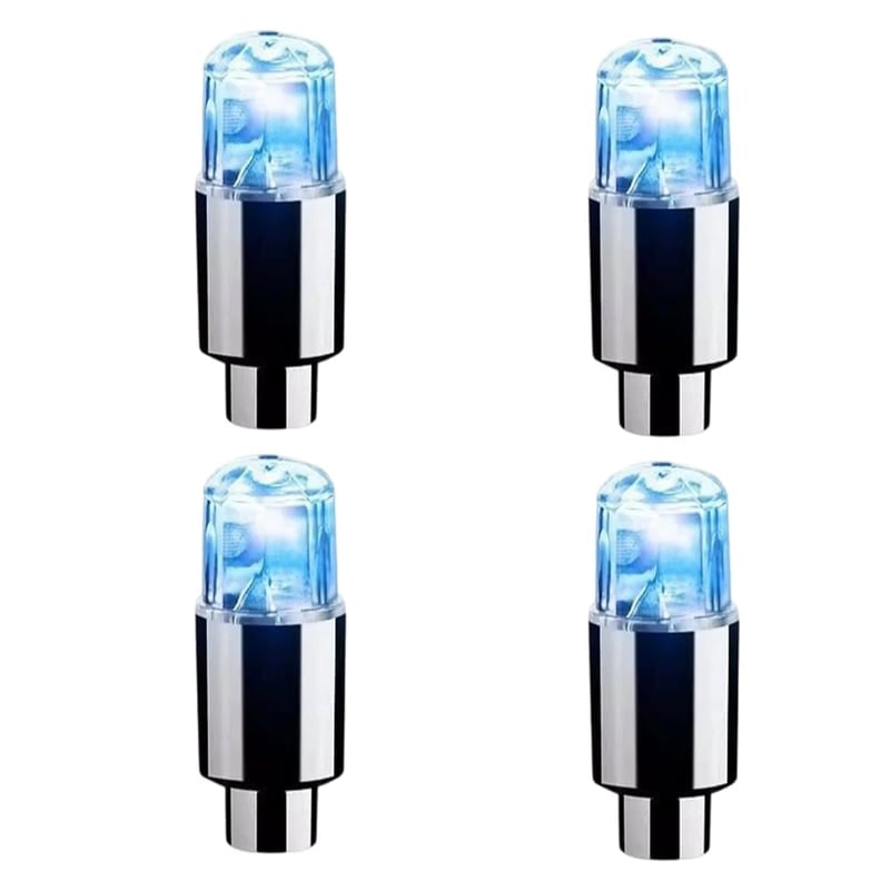 Waterproof LED tire valve cap lights glowing brightly on a car wheel at night