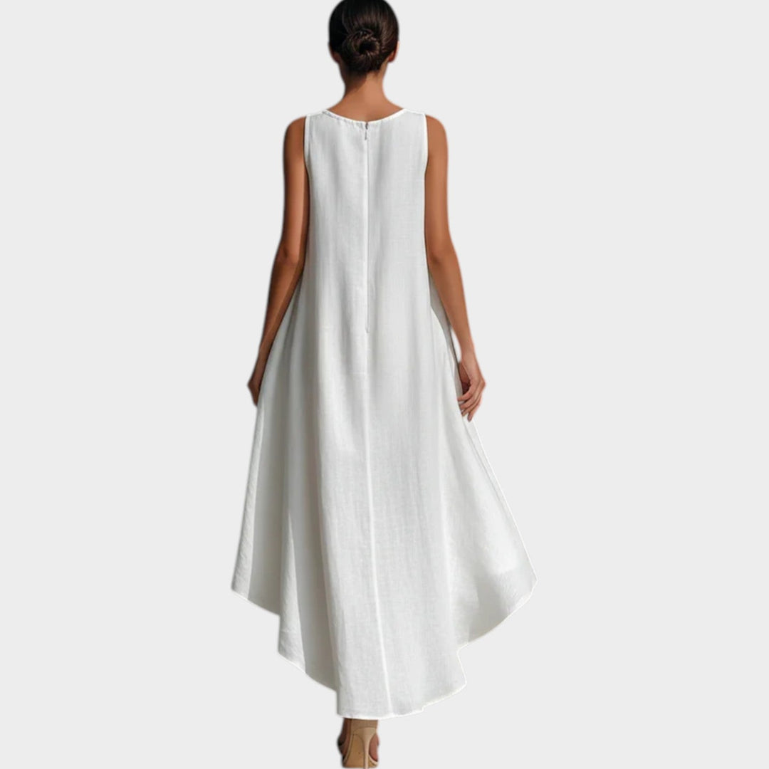 Back view of a woman modeling a white sleeveless high-low midi dress
