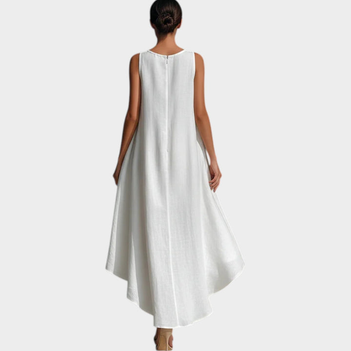 Back view of a woman modeling a white sleeveless high-low midi dress