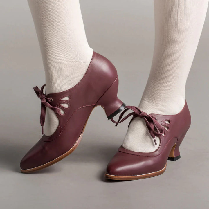 Pair of comfortable women's footwear with supportive low heels resting on a clean white surface.