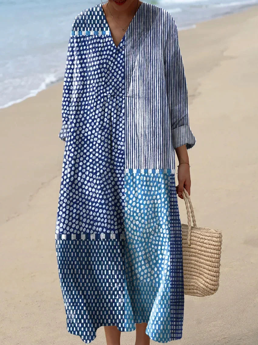 Women's blue casual dress with mixed pattern design worn at the beach