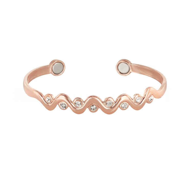 Detailed shot of the interlocking wave pattern on the copper wristband