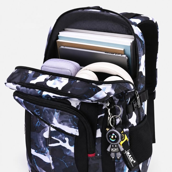 Open backpack showing well-organized interior compartments with books, tablet, and accessories