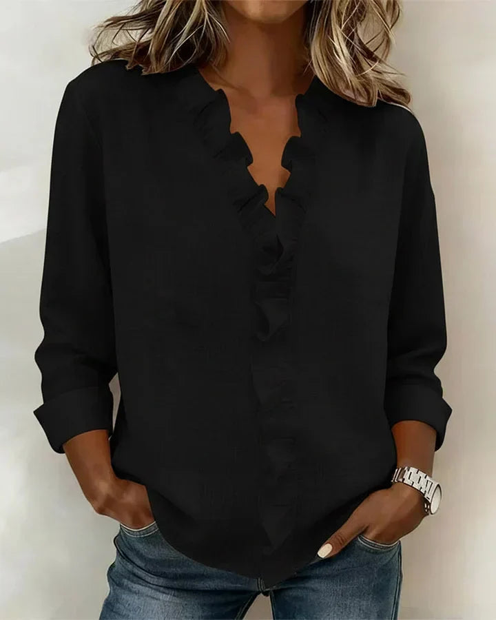 Elegant long sleeve blouse with ruffle details, side profile