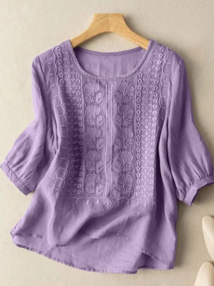 Close up of embroidery detail on a chic casual womens half sleeve blouse