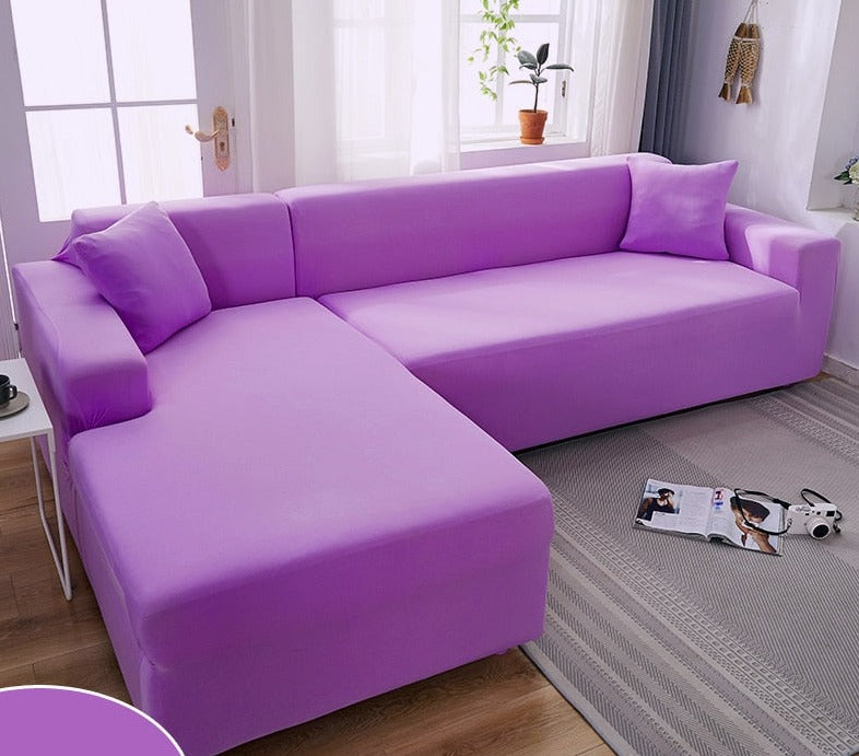 Machine washable furniture protector shown draped over living room sofa