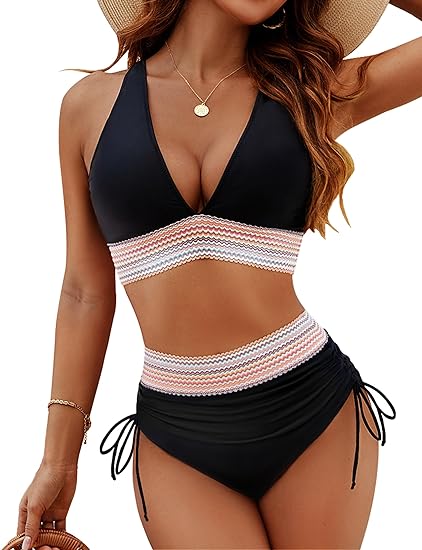 Woman wearing a black high-waisted tummy-control bikini set with a wave-patterned band.