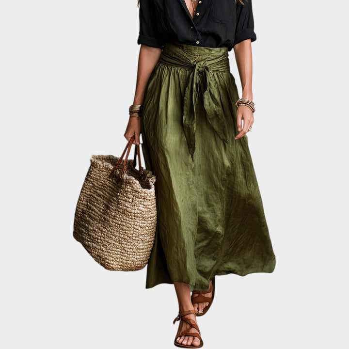 Close-up of the stylish black button shirt and tied high-waist maxi skirt