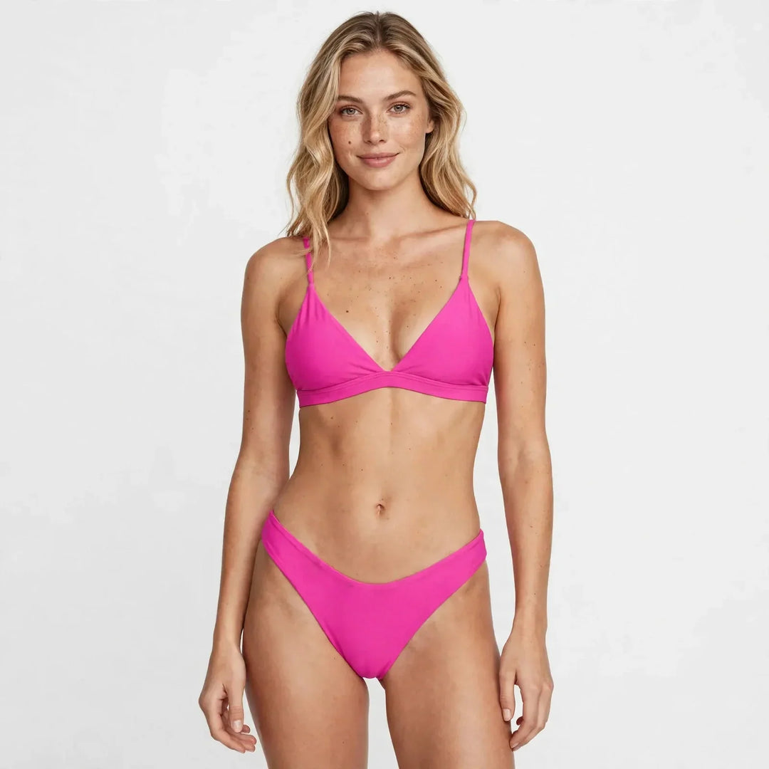 Model wearing a vibrant pink triangle bikini set with high-cut bottoms