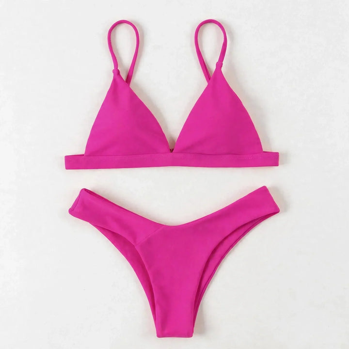 Flat lay of the pink triangle bikini set showing top and bottom pieces