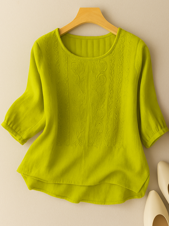 Back view of a womens relaxed fit embroidered summer blouse with half sleeves