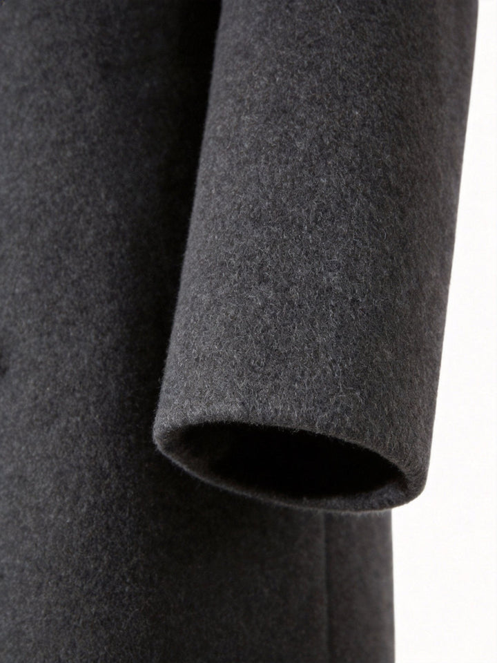 Detailed view of the adjustable sleeve straps on the men's outerwear.