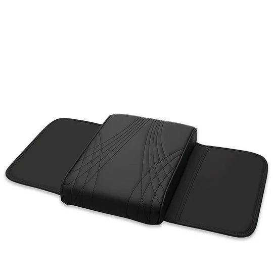 Black leather car armrest cushion laid flat showing quilted pattern