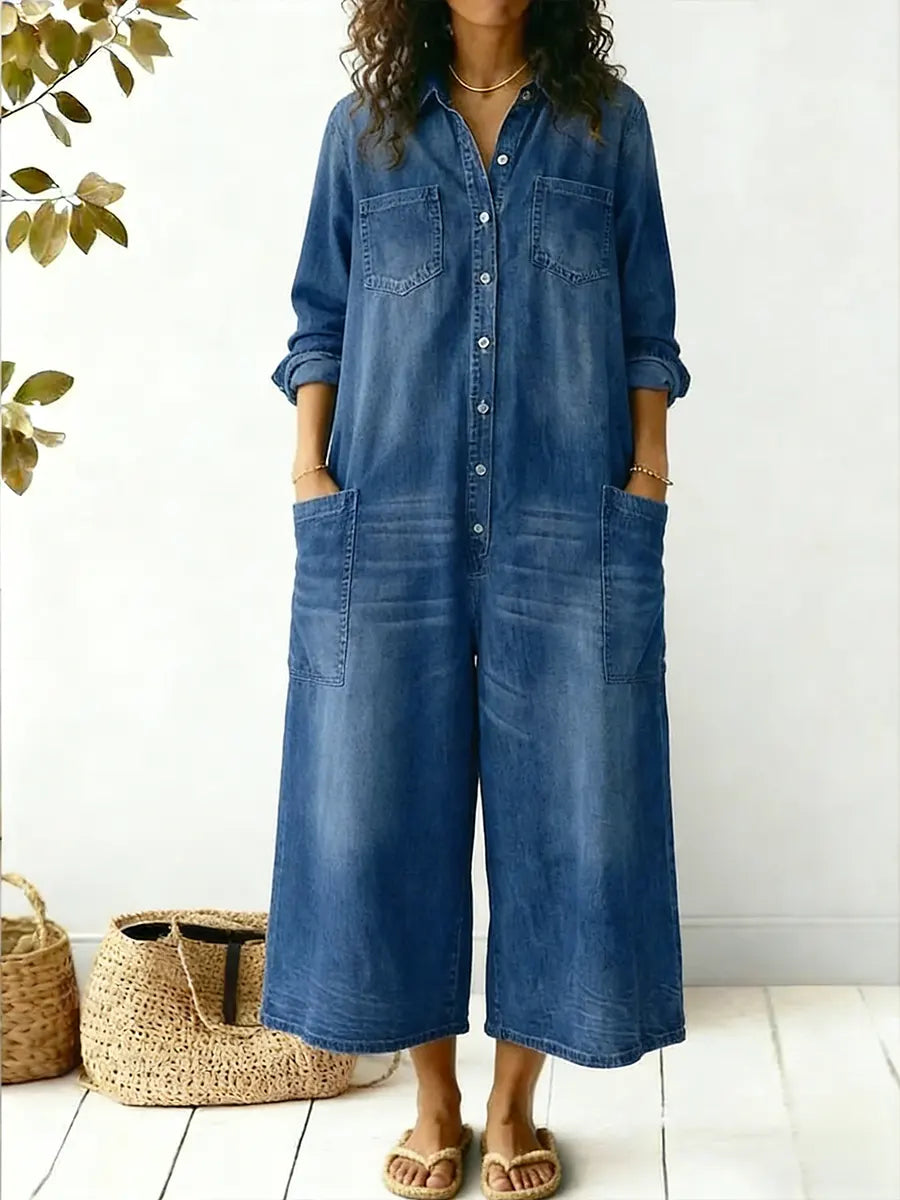 Front view of woman wearing blue wide-leg button-front jumpsuit