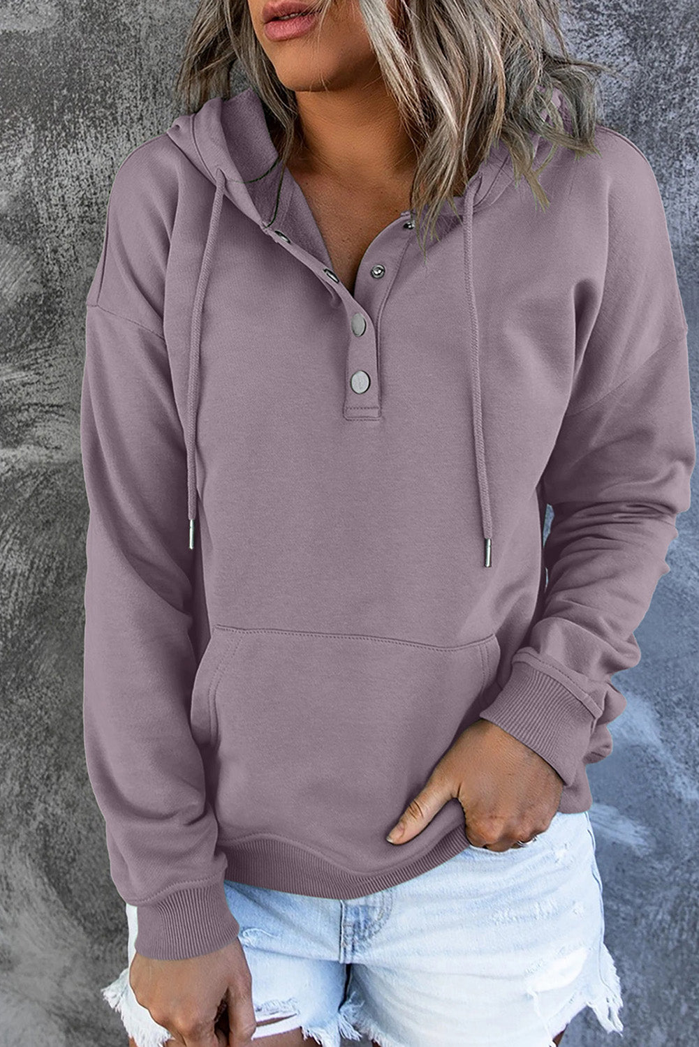 Soft green women's sweater with hood and front pocket