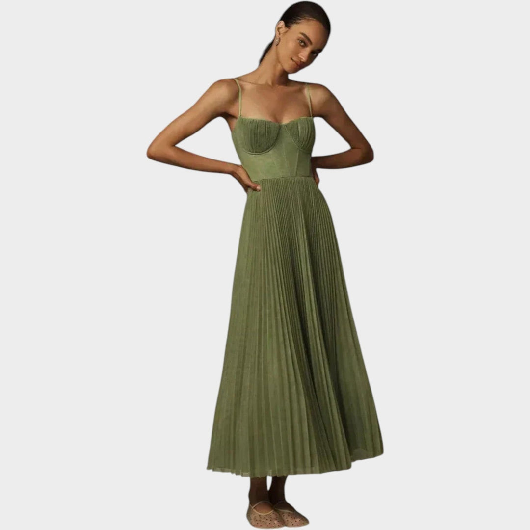 Model wearing a green pleated maxi formal dress with structured bodice