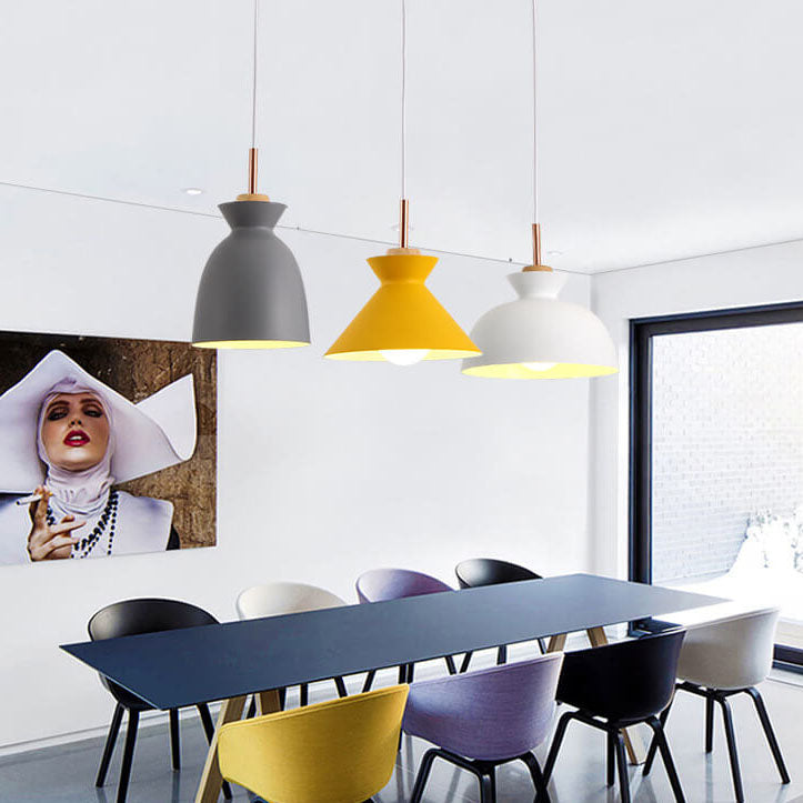 Modern Nordic pendant light chandelier hanging over a contemporary dining table in multiple colours