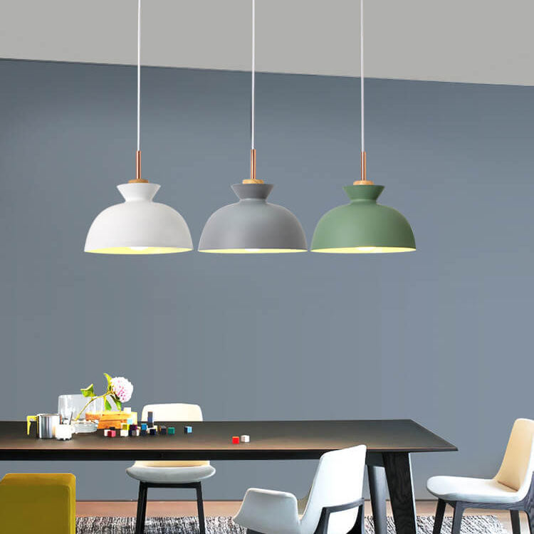 Minimalist nordic metal pendant light fixture against a neutral wall