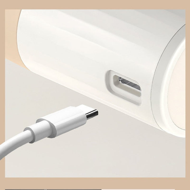 Close-up of the USB-C charging port on the electric scalp massager