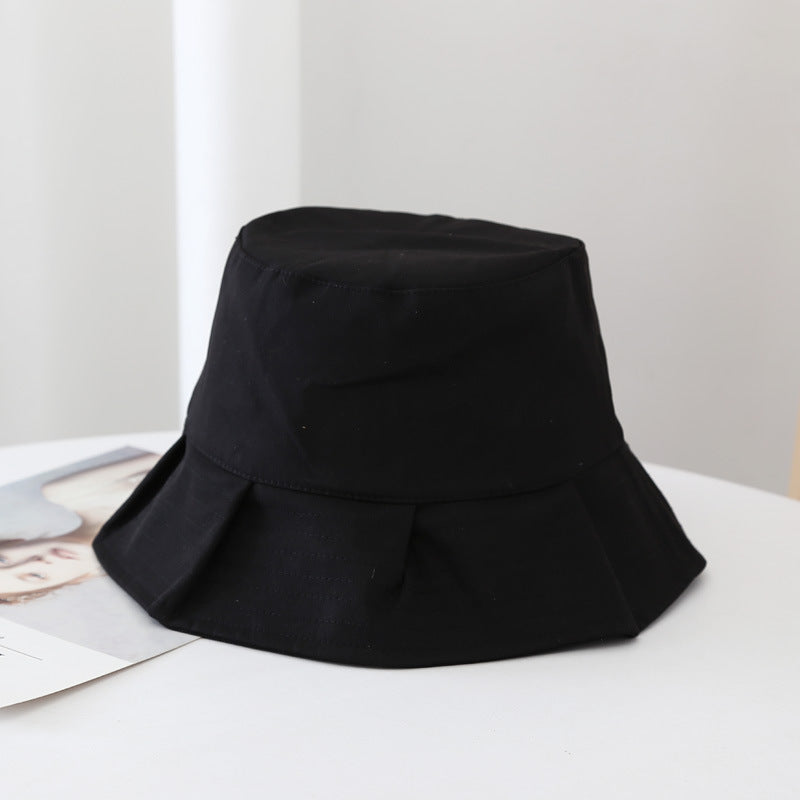 Black summer bucket hat on display
