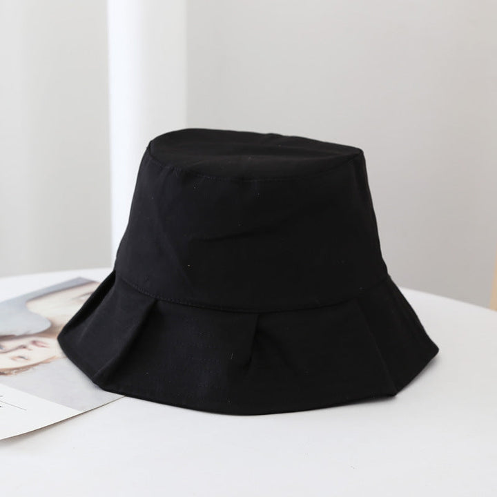 Black summer bucket hat on display