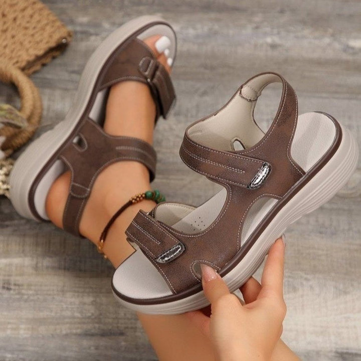 Detailed look at metal hardware and adjustable strap closure on women's summer sandals