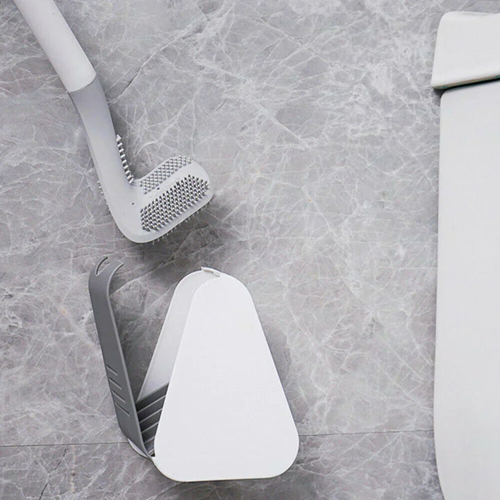 Wall mounted cleaning tool and modern toilet brush set in a home bathroom