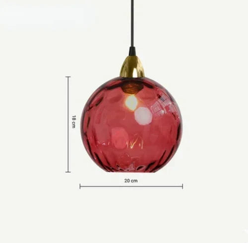 Contemporary glass globe pendant light in kitchen setting