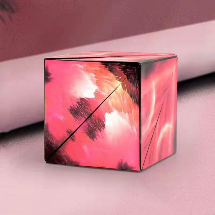 Geometric puzzle toy partially folded to demonstrate flexible transformation design