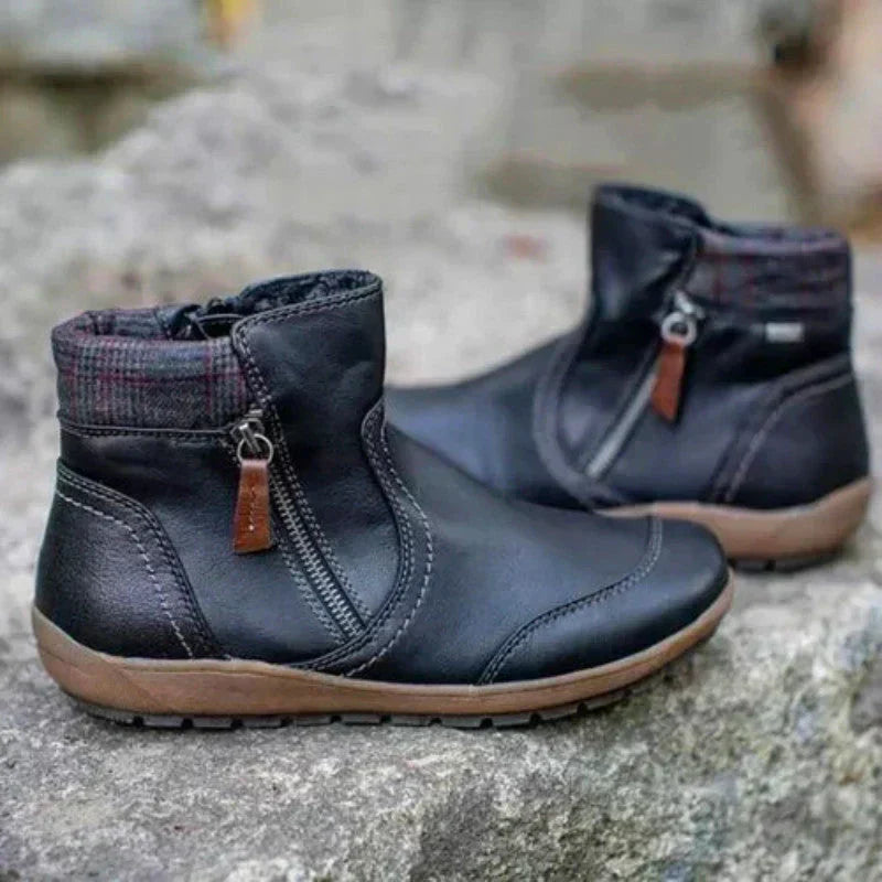 Black orthopedic waterproof ankle boot with textured collar trim