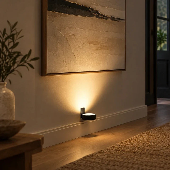 LED accent light shown with its magnetic mounting bracket for easy installation
