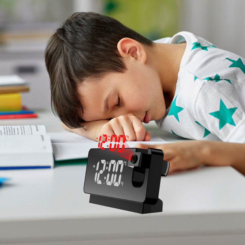 Modern LED projection alarm clock displaying time on the wall for bedroom use