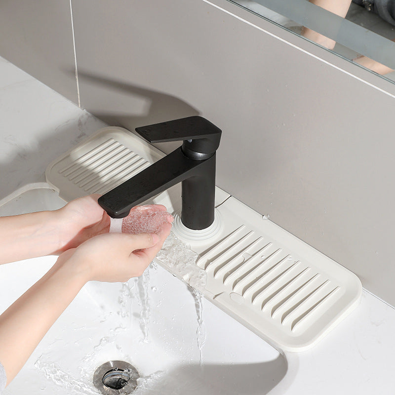Non-slip silicone counter protector mat holding plates and bowls