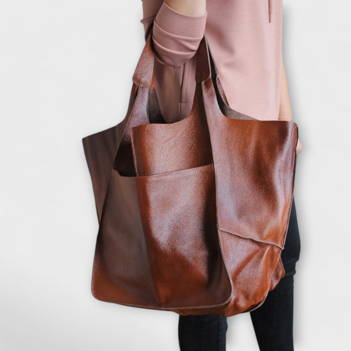 Womens shoulder bag showcasing minimalist design and comfortable strap drop.